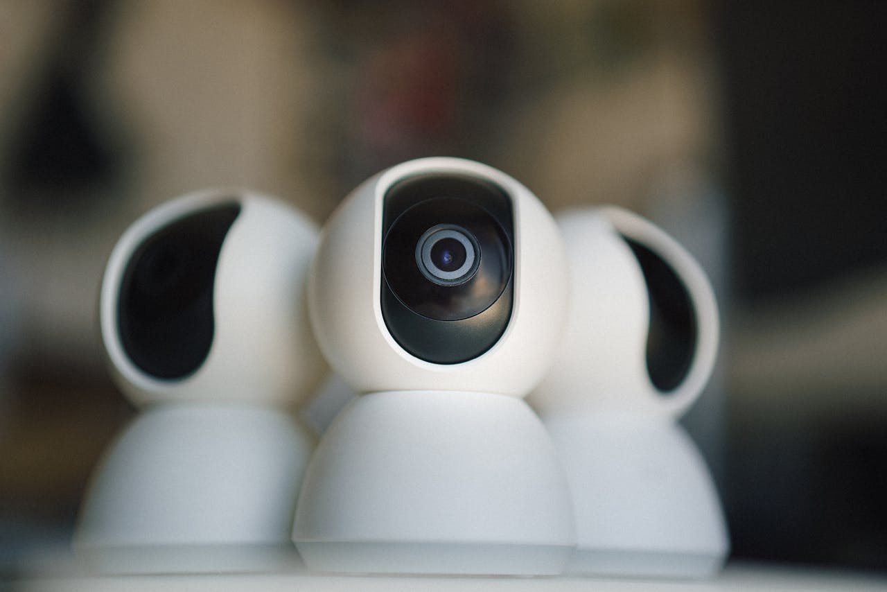 Close-up of sleek security cameras ensuring safety and privacy in indoor settings.